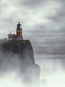 Preview wallpaper lighthouse, building, cliff, rock, fog
