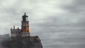 Preview wallpaper lighthouse, building, cliff, rock, fog