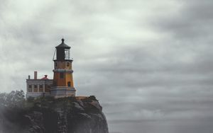 Preview wallpaper lighthouse, building, cliff, rock, fog