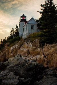 Preview wallpaper lighthouse, building, cliffs, sea, dusk