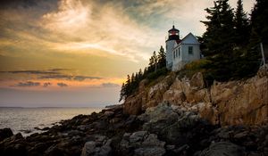 Preview wallpaper lighthouse, building, cliffs, sea, dusk