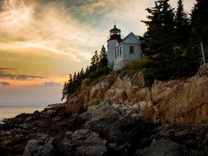 Preview wallpaper lighthouse, building, cliffs, sea, dusk