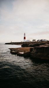 Preview wallpaper lighthouse, building, coast, sea, horizon, water