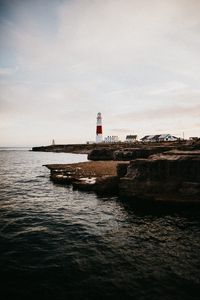 Preview wallpaper lighthouse, building, coast, sea, horizon, water