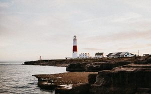 Preview wallpaper lighthouse, building, coast, sea, horizon, water