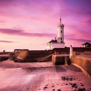 Preview wallpaper lighthouse, building, coast, stones