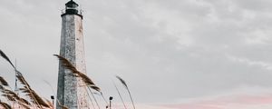 Preview wallpaper lighthouse, building, grass, coast, sea