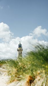 Preview wallpaper lighthouse, building, grasses, coast, sky
