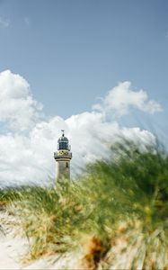 Preview wallpaper lighthouse, building, grasses, coast, sky