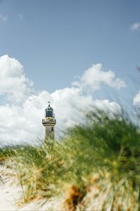 Preview wallpaper lighthouse, building, grasses, coast, sky