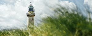 Preview wallpaper lighthouse, building, grasses, coast, sky