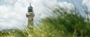 Preview wallpaper lighthouse, building, grasses, coast, sky