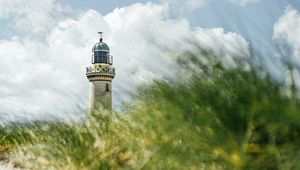 Preview wallpaper lighthouse, building, grasses, coast, sky