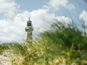 Preview wallpaper lighthouse, building, grasses, coast, sky