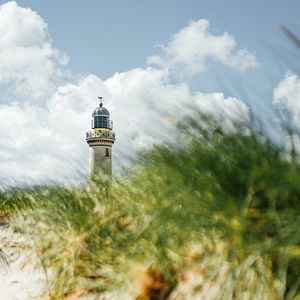 Preview wallpaper lighthouse, building, grasses, coast, sky