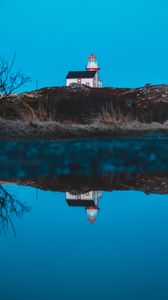 Preview wallpaper lighthouse, building, hill, water, reflection