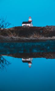 Preview wallpaper lighthouse, building, hill, water, reflection
