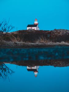 Preview wallpaper lighthouse, building, hill, water, reflection