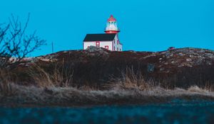 Preview wallpaper lighthouse, building, hill, water, reflection