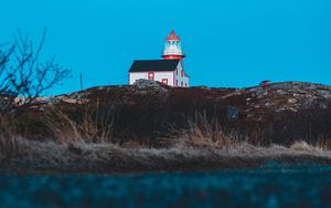 Preview wallpaper lighthouse, building, hill, water, reflection