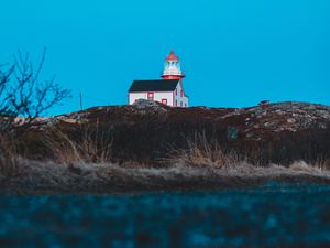 Preview wallpaper lighthouse, building, hill, water, reflection