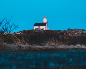 Preview wallpaper lighthouse, building, hill, water, reflection