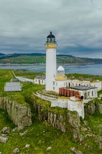 Preview wallpaper lighthouse, building, island, sea, coast