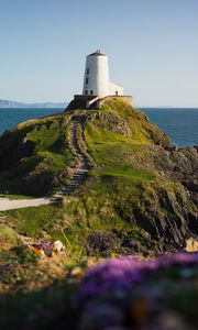 Preview wallpaper lighthouse, building, path, coast, sea