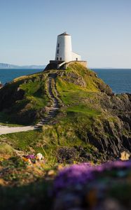 Preview wallpaper lighthouse, building, path, coast, sea