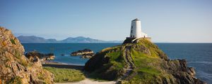 Preview wallpaper lighthouse, building, path, coast, sea