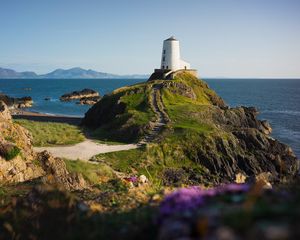 Preview wallpaper lighthouse, building, path, coast, sea
