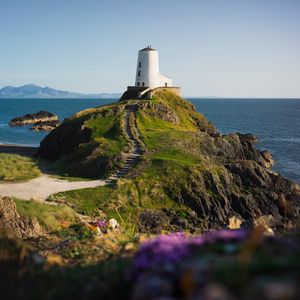 Preview wallpaper lighthouse, building, path, coast, sea