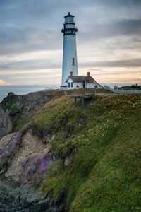 Preview wallpaper lighthouse, building, rocks, sea