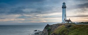 Preview wallpaper lighthouse, building, rocks, sea