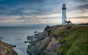 Preview wallpaper lighthouse, building, rocks, sea