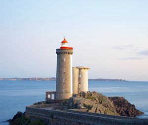 Preview wallpaper lighthouse, building, rocks, sea, horizon