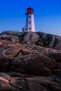 Preview wallpaper lighthouse, building, rocks, sea, coast