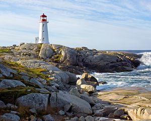 Preview wallpaper lighthouse, building, rocks, sea, sky