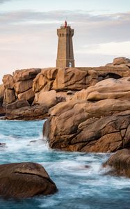 Preview wallpaper lighthouse, building, rocks, coast, stones, sea