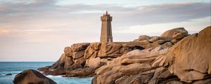 Preview wallpaper lighthouse, building, rocks, coast, stones, sea