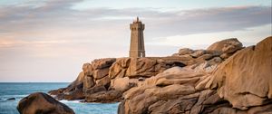 Preview wallpaper lighthouse, building, rocks, coast, stones, sea