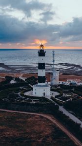 Preview wallpaper lighthouse, building, sea, sunset, horizon