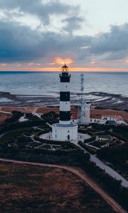 Preview wallpaper lighthouse, building, sea, sunset, horizon