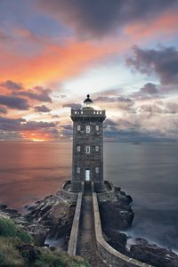 Preview wallpaper lighthouse, building, sea, shore, sunset
