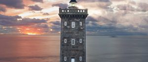 Preview wallpaper lighthouse, building, sea, shore, sunset