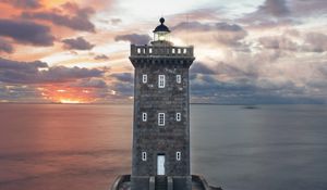 Preview wallpaper lighthouse, building, sea, shore, sunset