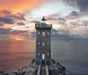 Preview wallpaper lighthouse, building, sea, shore, sunset