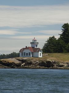 Preview wallpaper lighthouse, building, sea, coast, tree
