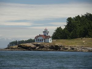 Preview wallpaper lighthouse, building, sea, coast, tree