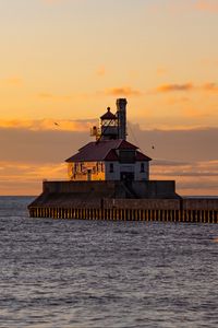 Preview wallpaper lighthouse, building, sea, sunset, waves